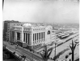 Union Station, across from the Chateau Laurier, in the 1920s. The tracks accessing the station, behind he building, are on what is now Colonel By Drive. In 1910, however, CPR filed plans with the city to close much of the Rideau Canal and use its bed for train tracks.