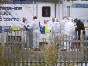 In this file photo taken on Nov. 1, 2018 Police investigators in forensics suits work at the helicopter crash site outside Leicester City Football Club's King Power Stadium in Leicester, eastern England, after the helicopter of the club's Thai chairman Vichai Srivaddhanaprabha went down on October 27 killing five passengers including the chairman. (DANIEL LEAL-OLIVAS/AFP/Getty Images)