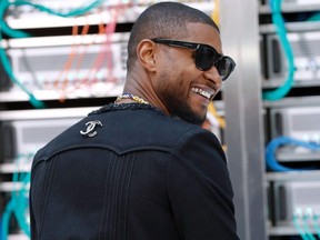 US singer Usher poses before the Chanel 2017 Spring/Summer ready-to-wear collection fashion show, on October 4, 2016 in Paris.