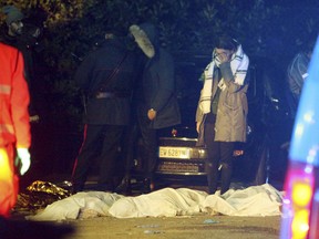 A girl cries as lifeless bodies lie on the ground outside disco Lanterna Azzurra in Corinaldo, central Italy, Saturday, Dec. 8, 2018.