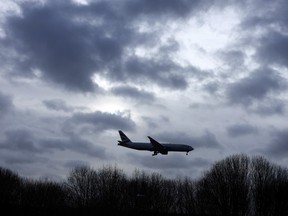 A plane comes in to land at Gatwick Airport in England, Friday, Dec. 21, 2018. (THE CANADIAN PRESS/AP/Kirsty Wigglesworth)