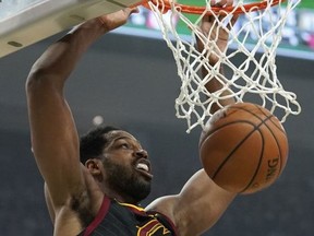 Cleveland Cavaliers' Tristan Thompson dunks during the first half of an NBA basketball game against the Milwaukee Bucks Monday, Dec. 10, 2018, in Milwaukee.