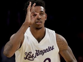 Los Angeles Lakers guard Nick Young celebrates after scoring during the first half of an NBA basketball game against the Los Angeles Clippers in Los Angeles, Sunday, Dec. 25, 2016.