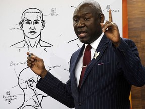 Attorney Ben Crump discusses the results of a forensic examination on Emantic "EJ" Bradford Jr., who was fatally shot by police in a shopping mall on Thanksgiving day, during a news conference in Birmingham, Ala., on Monday, Dec. 3, 2018.  (AP Photo/Jay Reeves)