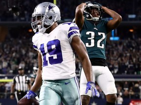 Cowboys wide receiver Amari Cooper runs for a touchdown past Philadelphia Eagles’ Rasul Douglas in overtime for a 29-23 win at AT&T Stadium in Arlington, Texas, yesterday.