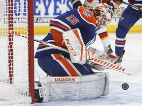 Edmonton Oilers goalie Mikko Koskinen (19) makes the save on Calgary Flames during first period NHL action in Edmonton on Sunday, Dec. 9, 2018. THE CANADIAN PRESS/Jason Franson