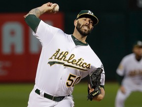 In this Sept. 5, 2018, file photo, Oakland Athletics pitcher Mike Fiers throws to a New York Yankees batter during the first inning of a baseball game in Oakland, Calif.