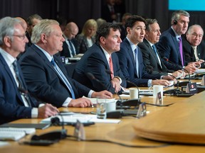 Prime Minister Justin Trudeau addresses the opening session of the first ministers meeting in Montreal on Friday, Dec. 7, 2018, flanked by New Brunswick Premier Blaine Higgs, Ontario Premier Doug Ford, Intergovernmental Affairs Minister Dominic Leblanc and Premiers Francois Legault of Quebec, Stephen McNeil of Nova Scotia and Bob McLeod of the Northwest Territories.