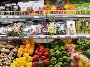 Produce is shown in a grocery store in Toronto on Friday, Nov. 30, 2018. An annual report estimates the average Canadian family will pay about $400 more for groceries and roughly $150 more for dining out next year.