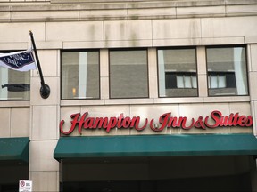 In this file photo, a sign marks the location of a Hampton Inn and Suites on Sept. 12, 2013 in Chicago.   (Photo by Scott Olson/Getty Images)