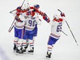 Montreal Canadiens left wing Tomas Tatar celebrates with teammates after scoring against the Chicago Blackhawks during the third period of an NHL hockey game Sunday, Dec. 9, 2018, in Chicago.