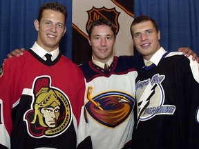 The 2001 NHL entry draft's top three picks, Jason Spezza, left, selected by the Ottawa Senators second overall, Ilya Kovalchuk selected by the Atlanta Thrashers first overall, and Alexander Svitov selected by the Tampa Bay Lightning third overall, pose together following the first round of the draft Saturday June 23, 2001 at the National Car Rental Center in Sunrise, Fla.