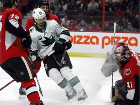 Sharks defenceman Erik Karlsson (65) sprays ice shavings on his former teammate, Senators goalie Craig Anderson, in the first period of Saturday's game at Canadian Tire Centre.