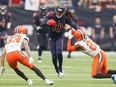 DeAndre Hopkins of the Houston Texans runs the ball after a catch defended by Damarious Randall #23 and Phillip Gaines #33 of the Cleveland Browns in the second quarter at NRG Stadium on Dec. 2, 2018 in Houston, Texas.