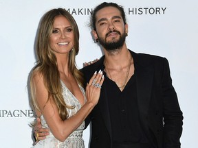 In this May 17, 2018, file photo, model Heidi Klum, left, and musician Tom Kaulitz pose for photographers upon arrival at the amfAR, Cinema Against AIDS, benefit at the Hotel du Cap-Eden-Roc, during the 71st international Cannes film festival, in Cap d'Antibes, southern France.