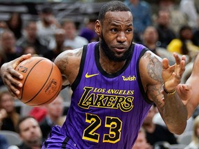 In this Dec. 7, 2018, file photo, Los Angeles Lakers' LeBron James drives against the San Antonio Spurs during the first half of an NBA game, in San Antonio.