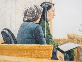 In this courtroom sketch, Meng Wanzhou, back right, the chief financial officer of Huawei Technologies, sits beside a translator during a bail hearing at B.C. Supreme Court in Vancouver, on Friday Dec. 7, 2018.