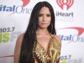 In this Dec. 1, 2017 file photo, Demi Lovato arrives at Jingle Ball at The Forum in Inglewood, Calif.
