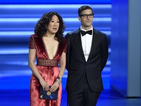 In this Sept. 17, 2018 file photo, Sandra Oh, left, and Andy Samberg present an award at the 70th Primetime Emmy Awards in Los Angeles.