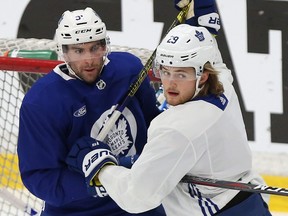 John Tavares (left) and William Nylander jockey for position as the Toronto Maple Leafs worked out on Dec. 7, 2018.