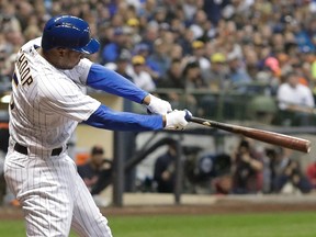 In this Sept. 29, 2018, file photo, Milwaukee Brewers' Jonathan Schoop hits an RBI-double during the fourth inning of a baseball game against the Detroit Tigers in Milwaukee.