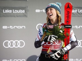 Mikaela Shiffrin, of the United States, celebrates her victory on the podium following the women's World Cup Super-G ski race at Lake Louise on Sunday.