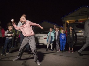 Range View Elementary School third grader Dane Best throws the first legal snowball in the parking lot of the Town Hall after presenting his argument to the town board trustees to change a law in Severance that bans snowball fights on Monday, Dec. 3, 2018, at the Town Hall in Severance, Colo. The board earlier voted unanimously to approve the law change. (Timothy Hurst/The Coloradoan via AP) ORG XMIT: COFOR101