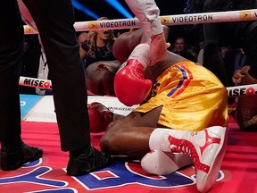Adonis Stevenson is being checked out after being knocked out by Oleksandr Gvosdyk during their WBC light heavyweight championship fight at the Videotron Center on Dece. 1, 2018 in Quebec City, Que.