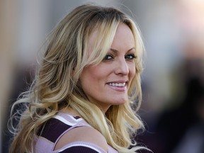 Stormy Daniels attends the opening of the adult entertainment fair 'Venus' in Berlin, Germany, Thursday, Oct. 11, 2018. (AP Photo/Markus Schreiber)