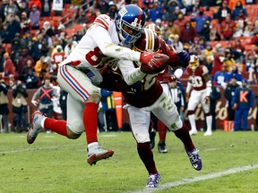 New York Giants wide receiver Russell Shepard crosses the goal line for a touchdown in front of Washington Redskins free safety D.J. Swearinger during the second half of an NFL fgame Sunday, Dec. 9, 2018, in Landover, Md.