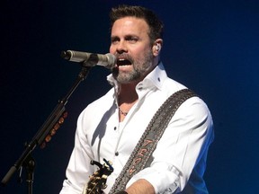 FILE - In this Jan. 17, 2013 file photo, Troy Gentry of the Country Music duo Montgomery Gentry performs on the Rebels On The Run Tour in Lancaster, Pa. Federal investigators say pilot error following engine maintenance problems caused a helicopter crash last year that killed Gentry and the pilot in New Jersey. The September 2017 crash occurred during a pleasure flight for Gentry at the Flying W Airport in Medford, where he was to perform that night at the airport's resort.