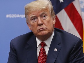 President Donald Trump listens to questions from members of the media during his meeting with Germany's Chancellor Angela Merkel at the G20 Summit, Saturday, Dec. 1, 2018 in Buenos Aires, Argentina.