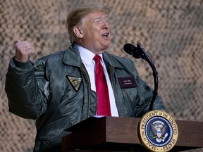 U.S. President Donald Trump speaks at a hanger rally at Al Asad Air Base, Iraq, Wednesday, Dec. 26, 2018.