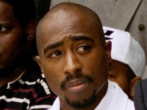 In this Aug. 15, 1996, file photo, rapper Tupac Shakur attends a voter registration event in South Central Los Angeles.