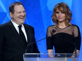 In this April 20, 2013, file photo, Harvey Weinstein (L) and Jennifer Lawrence speak onstage during the 24th Annual GLAAD Media Awards at JW Marriott Los Angeles.