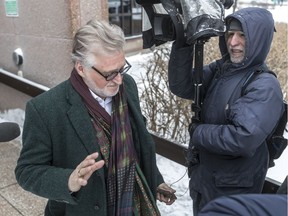 Just for Laughs founder Gilbert Rozon refuses to answer reporters' question at a Montreal police station Jan. 8, 2019.