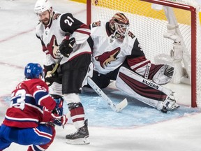 Coyotes goaltender Calvin Pickard robs Canadiens' Victor Mete of a goal while teammate Derek Stepan looks on Wednesday night at the Bell Centre.