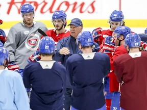 Canadiens coach Claude Julien speaks to his players during practice in Brossard Thursday afternoon.