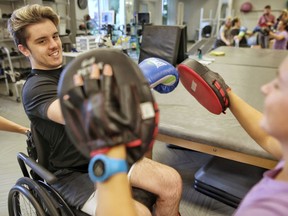 Humboldt Broncos bus crash survivor Ryan Straschnitzki, attends physiotherapy at synaptic in Calgary, on Tuesday Aug. 28, 2018.