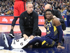 Victor Oladipo of the Indiana Pacers is attended to by medical staff after being injured in the second quarter of the game against the Toronto Raptors at Bankers Life Fieldhouse on January 23, 2019 in Indianapolis, Indiana. (Photo by Andy Lyons/Getty Images)