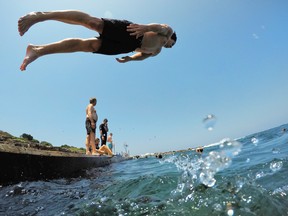 A man dives into the water at Clovelly on Jan. 25, 2019 in Sydney, Australia.  (Mark Evans/Getty Images)