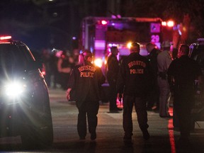 Police investigate the scene where several Houston Police officers were shot in Houston on Monday, Jan. 28, 2019. At least five Houston officers were injured in a shooting Monday in an incident involving a suspect and taken to a hospital, police said. (Brett Coomer/Houston Chronicle via AP)