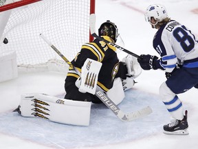 Winnipeg Jets left wing Kyle Connor (81) beats Boston Bruins goaltender Jaroslav Halak for the only goal during a shootout following an overtime period of an NHL hockey game in Boston, Tuesday, Jan. 29, 2019.  (AP Photo/Charles Krupa)