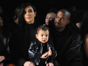 Kim Kardashian, North West and Kanye West attend the Alexander Wang Fashion Show during Mercedes-Benz Fashion Week Fall 2015 at Pier 94 on February 14, 2015 in New York City.  (Craig Barritt/Getty Images)