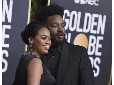 Ryan Coogler, right, and Zinzi Evans arrive at the 76th annual Golden Globe Awards at the Beverly Hilton Hotel on Sunday, Jan. 6, 2019, in Beverly Hills, Calif.