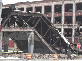 A pedestrian bridge that once was part of a Packard auto assembly plant has collapsed, leaving a pile of rubble in Detroit, Mich., on Wednesday, Jan. 23, 2019. (Daniel Mears/Detroit News via AP)