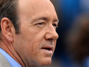 In this file photo taken on June 12, 2013 US actor Kevin Spacey watches as France's Nicolas Mahut plays Scotland's Andy Murray during their ATP Aegon Championships tennis match at the Queen's Club in west London.