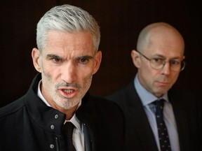 Former Australian football player Craig Foster (L) speaks to the media as he stands next to Executive Director of the World Players Association  Brendan Schwab (R) after handing over a petition to FIFA calling for Hakeem Al-Araibi to be freed on January 28, 2019 in Zurich.