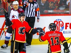 Calgary Flames forward Mikael Backlund celebrates with teammate Johnny Gaudreau after scoring against the Colorado Avalanche in NHL hockey at the Scotiabank Saddledome in Calgary on Wednesday. Photo by Al Charest/Postmedia