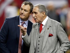 Atlanta Falcons owner Arthur Blank talks with TV analyst John Lynch prior to the game against the Seattle Seahawks at the Georgia Dome on January 14, 2017 in Atlanta. (Gregory Shamus/Getty Images)
